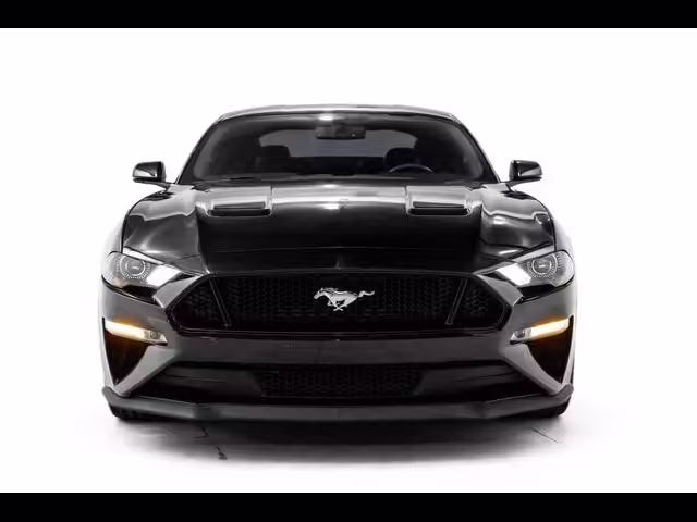 Affordable sports cars that look exotic including Ford Mustang, Chevrolet Camaro, Dodge Challenger, Hyundai Genesis Coupe, and Nissan 370Z