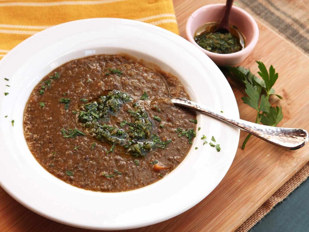 Bowl of homemade lentil soup prepared as a healthy dinner for two