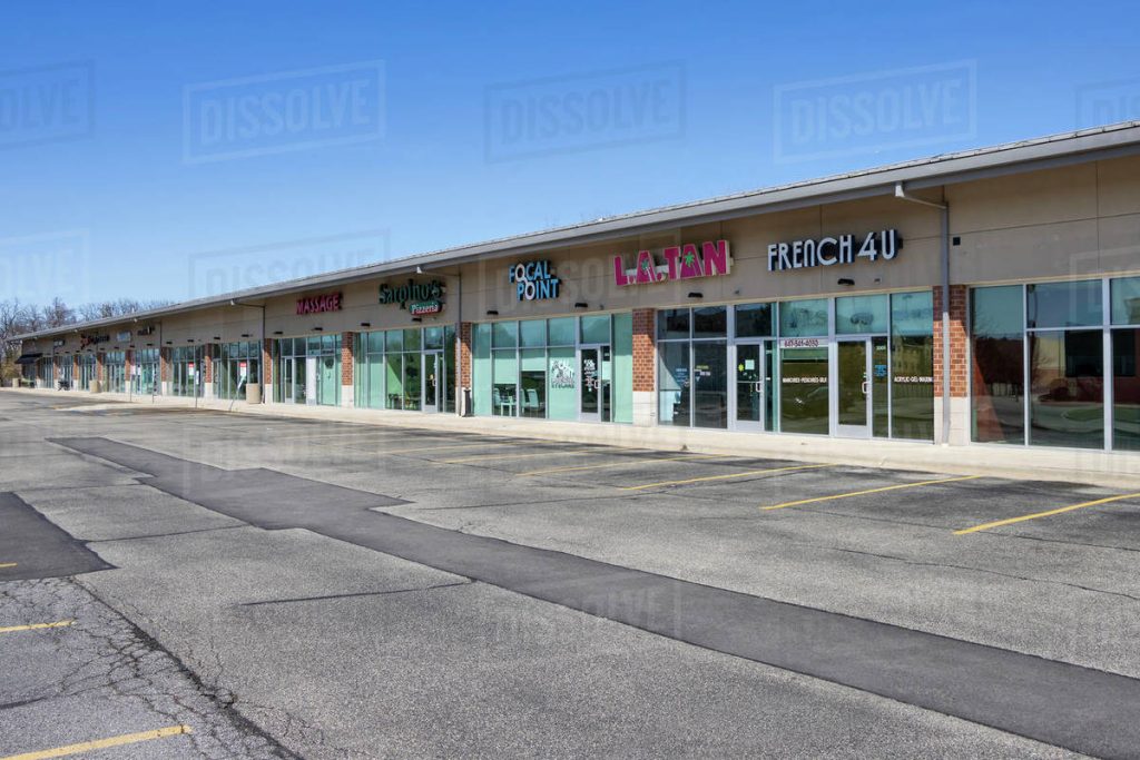 Closed retail storefront in strip mall (dirt cheap stores closing)