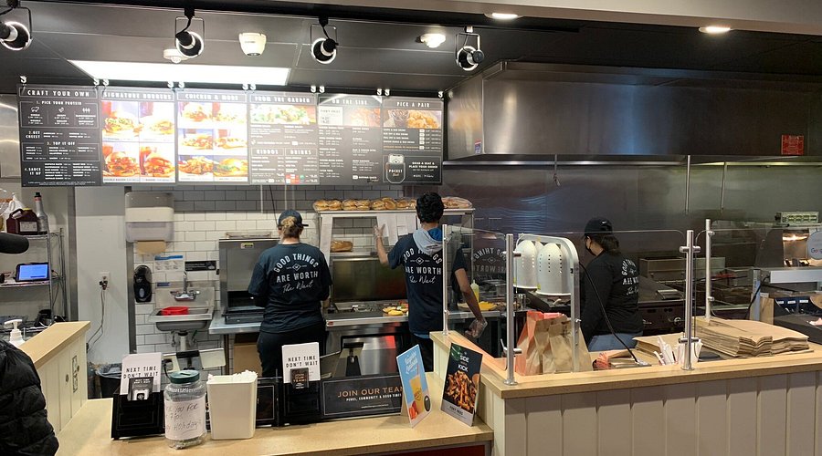 Customer ordering burger at fast food counter
