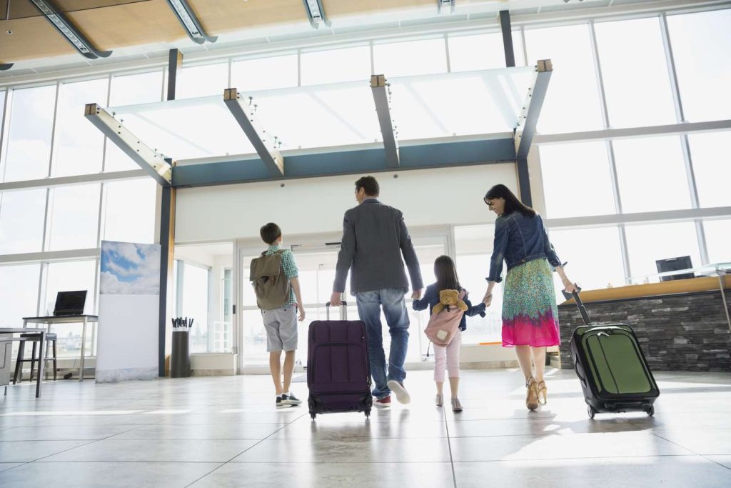 Family boarding airplane for trip. (cheap flights from Cleveland)
