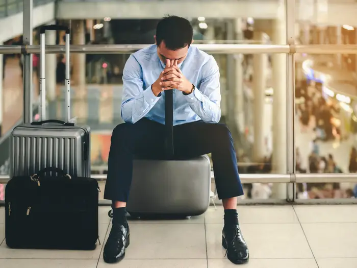 Frustrated traveler seeing expensive flight prices