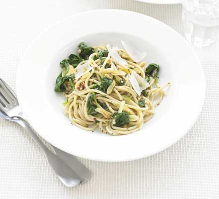 Garlic butter pasta with spinach cooked for two, plated and ready to serve