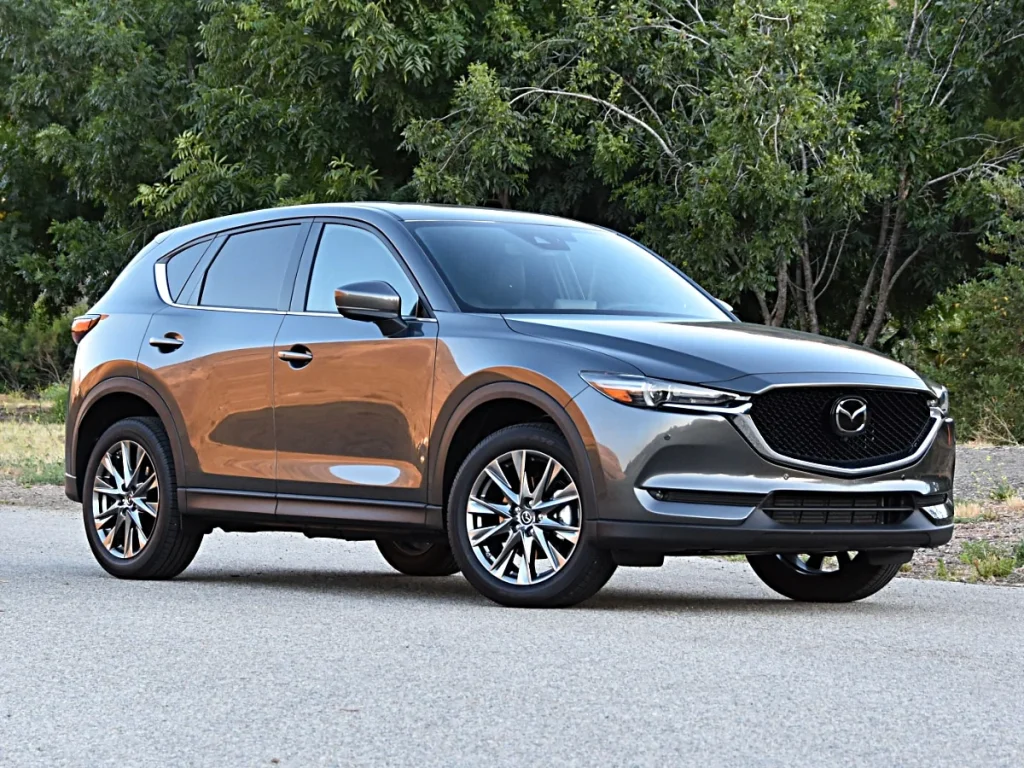 Affordable SUVs that look expensive including Mazda CX-5, Hyundai Tucson, Ford Edge, Buick Enclave, and Kia Telluride