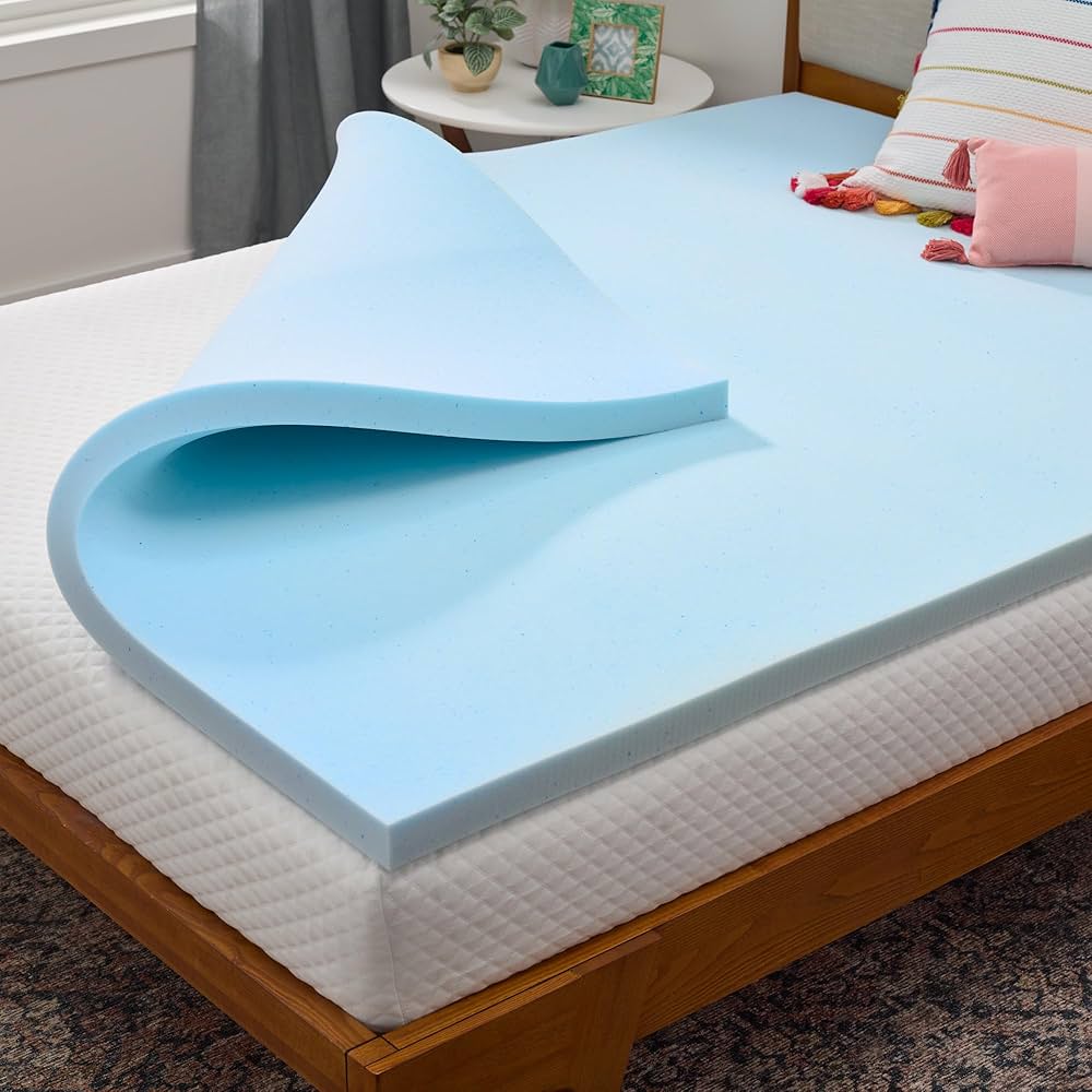 Memory foam mattress topper placed on bed