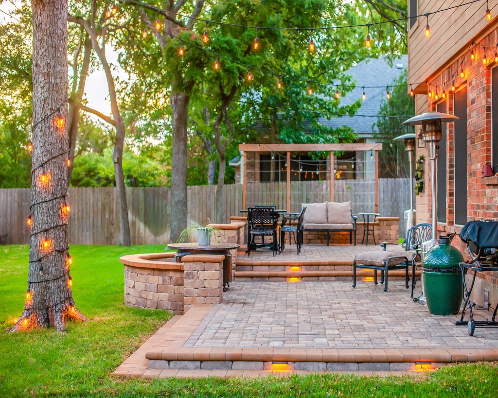Modern no-grass backyard compared visually to traditional green grass lawn.