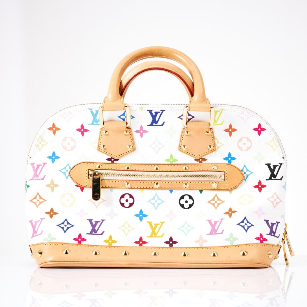 Person browsing designer bags on online marketplace