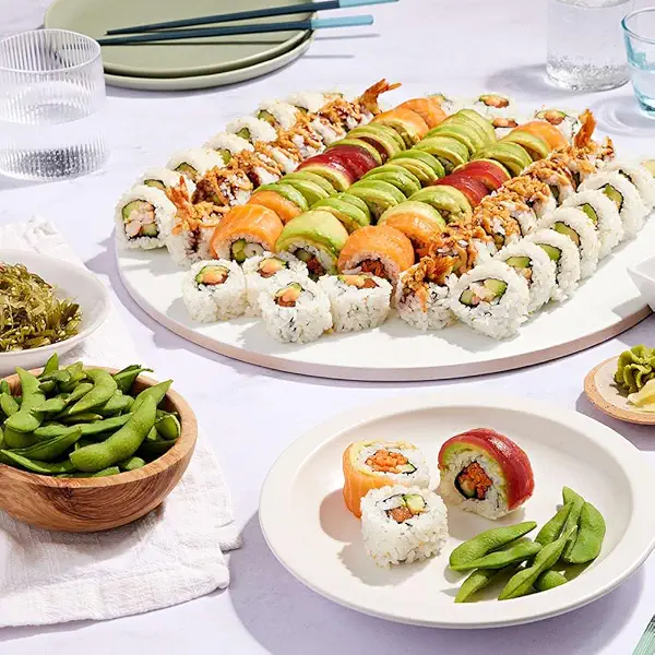 Prepackaged sushi trays displayed in a grocery store.