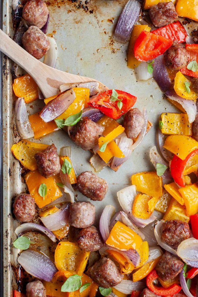 Sheet pan sausage with roasted vegetables prepared for two