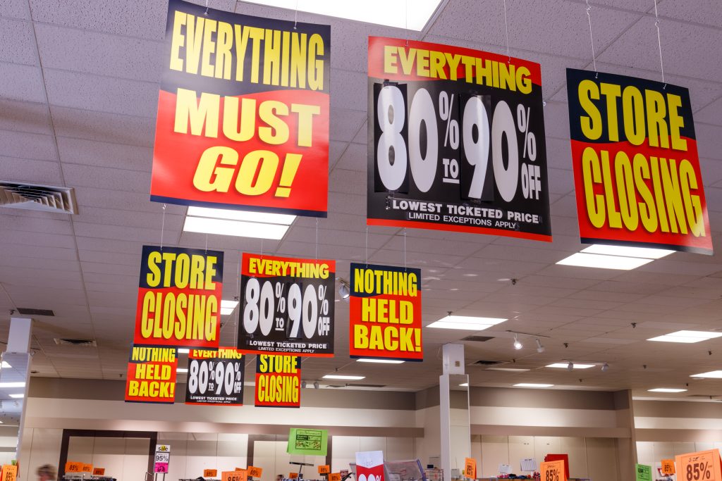 Shoppers browsing merchandise during liquidation sale