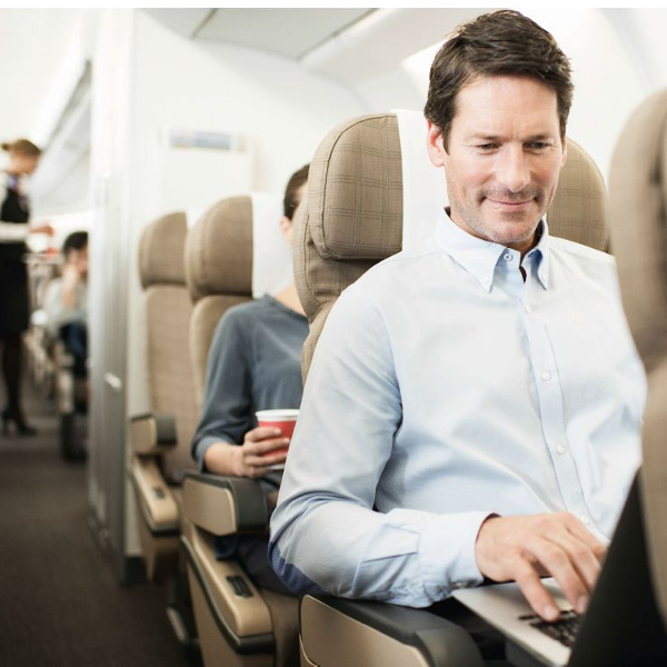 Traveler checking flight deals online on laptop