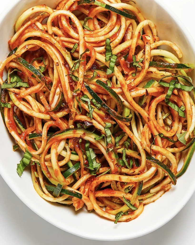 Zucchini noodles with marinara sauce served as a healthy dinner for two