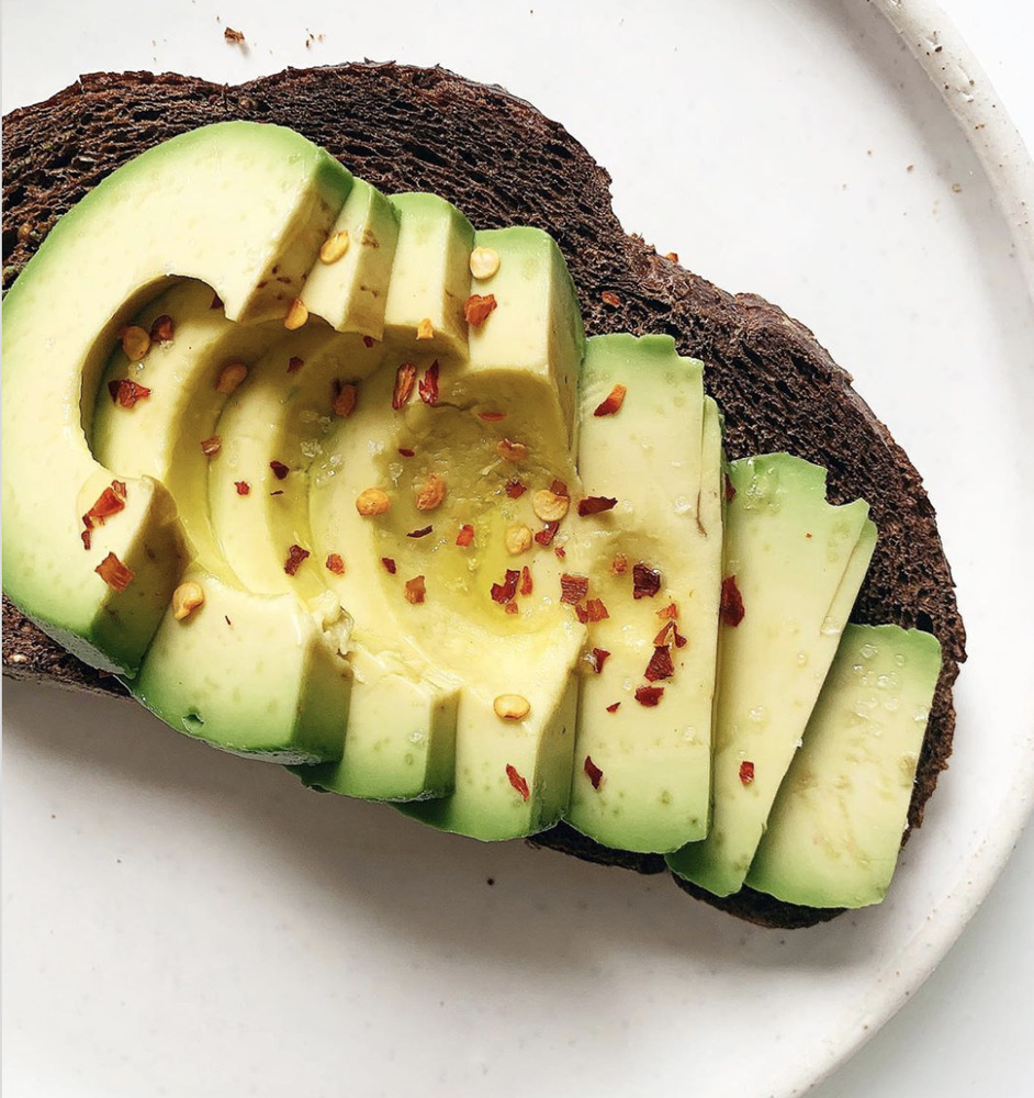 Affordable gourmet-style breakfast including avocado toast, breakfast burrito, smoothie bowl, and pancakes.