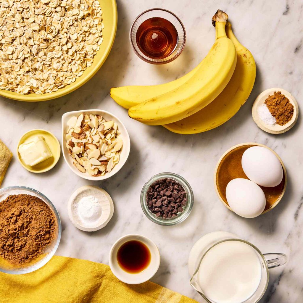 Budget-friendly breakfast ingredients including eggs, bread, oats, and bananas in a grocery basket.