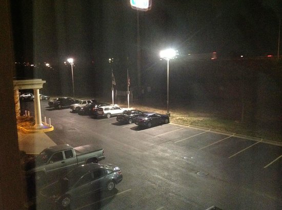 poorly lit motel parking lot