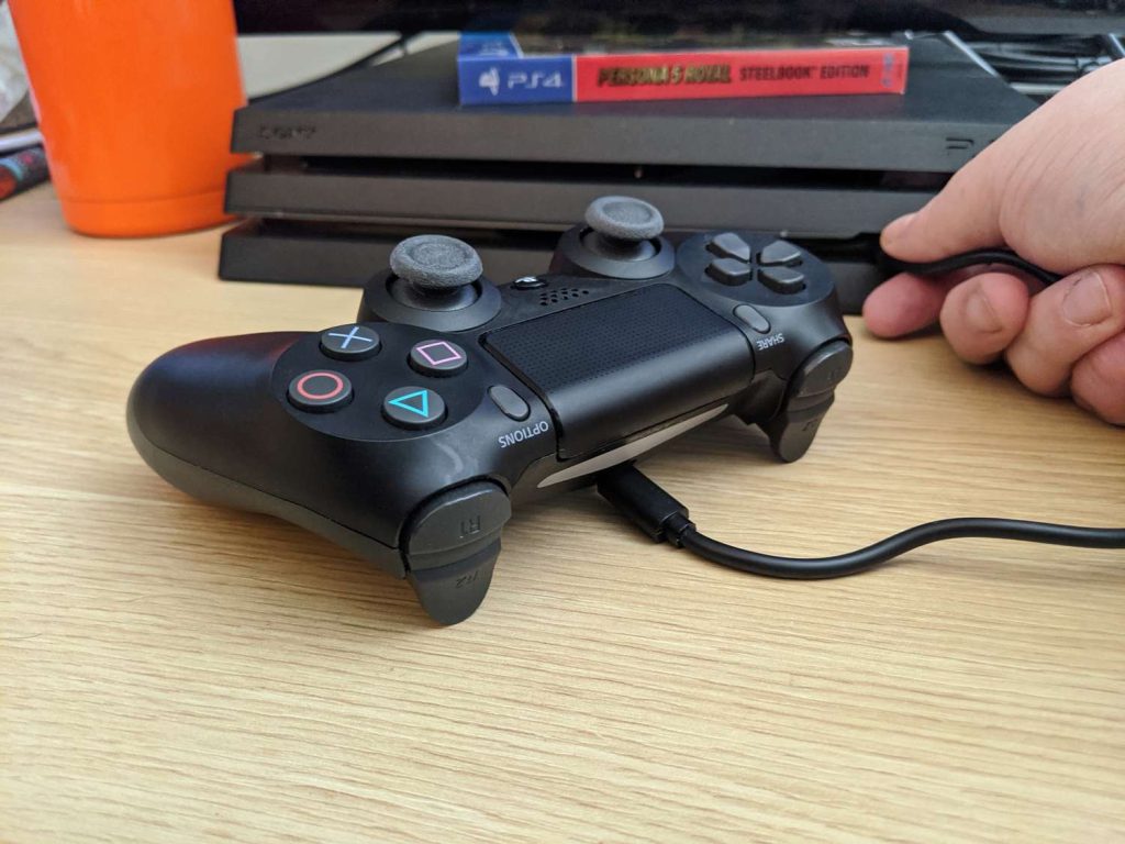 Proper cleaning, charging, and storage practices to extend the lifespan of a PS4 controller