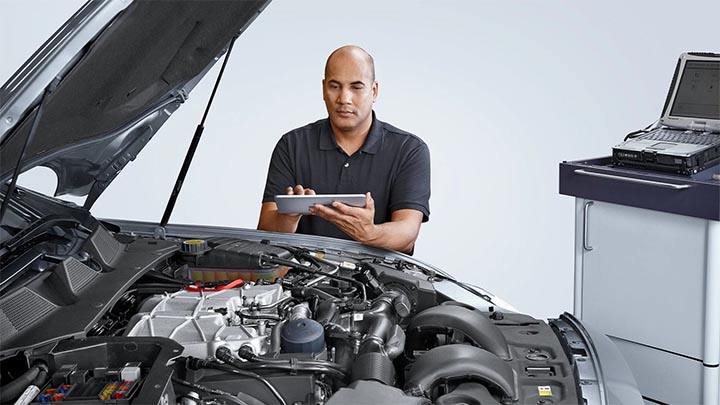 BMW warranty document next to car keys