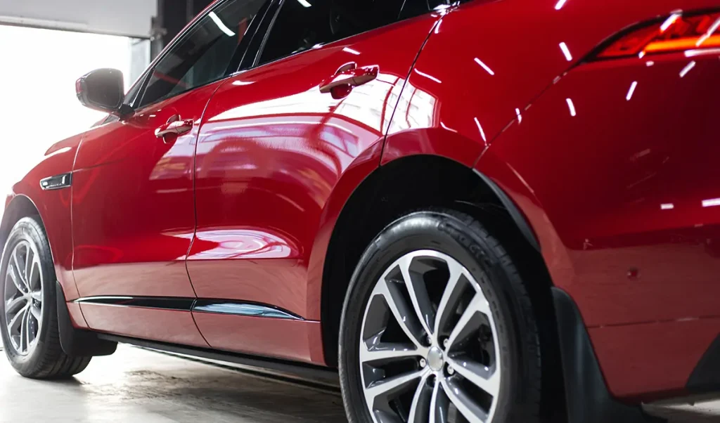 Car with ceramic coating showing deep glossy finish. (cheap cars that look expensive)