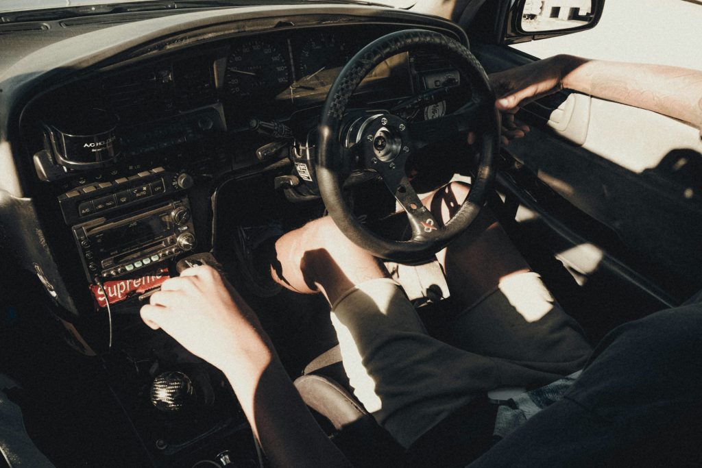 Affordable V8 muscle car parked on suburban street in the United States