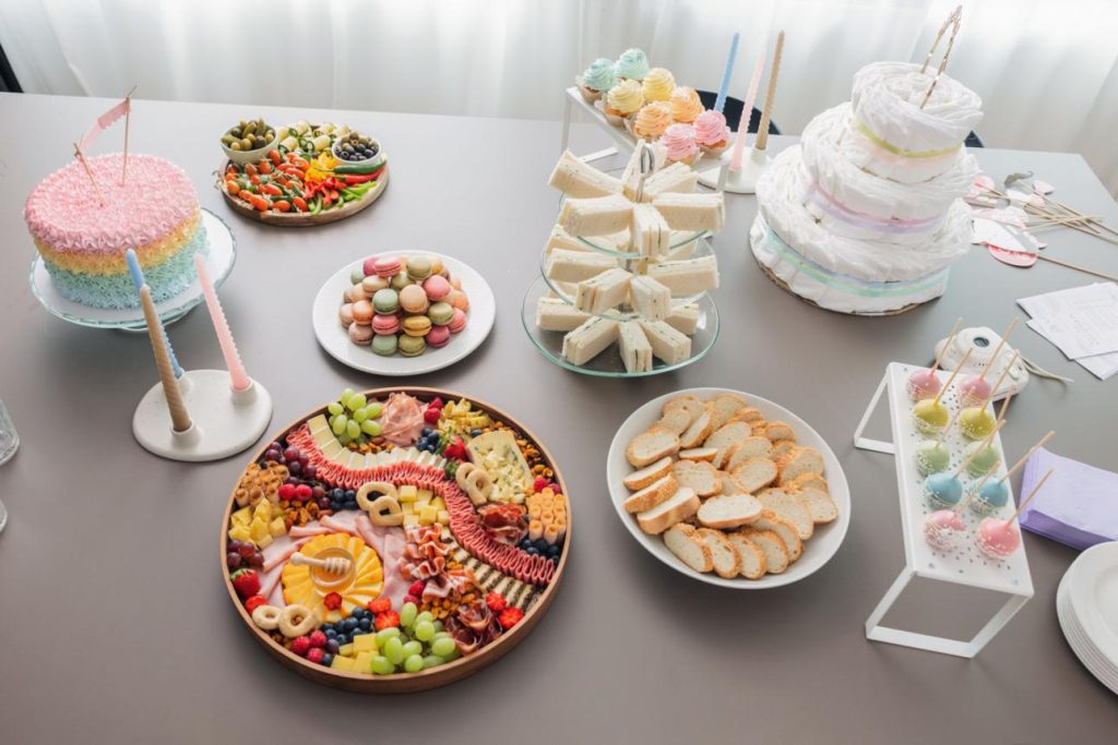 Baby shower dessert station with cupcakes and donuts