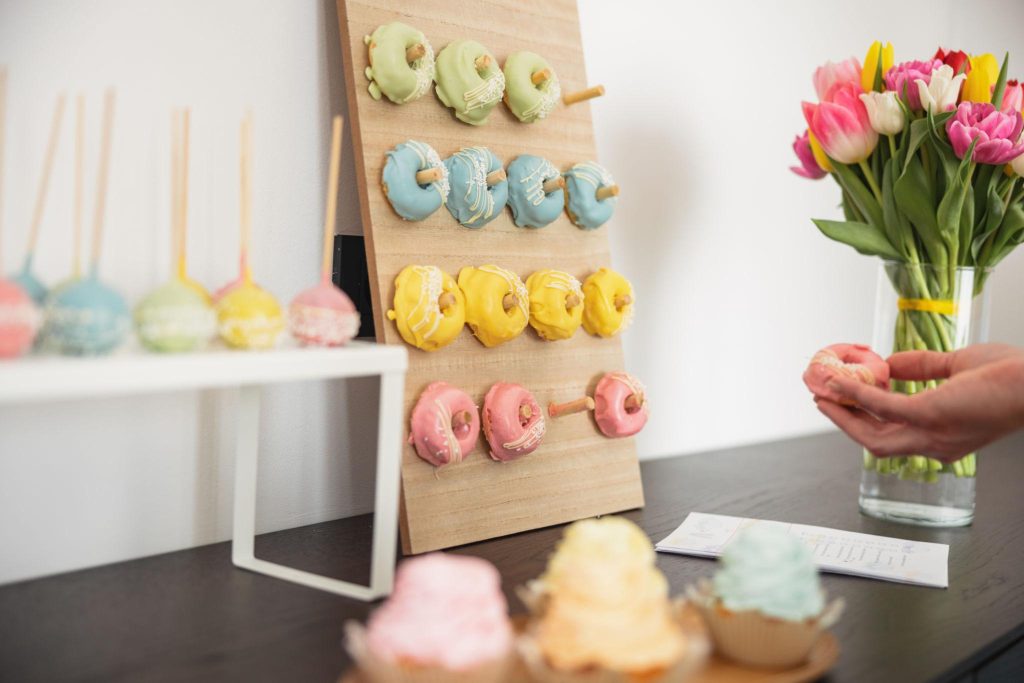 Baby shower dessert station with cupcakes and donuts