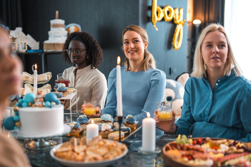 Baby shower host serving inexpensive but beautifully presented food