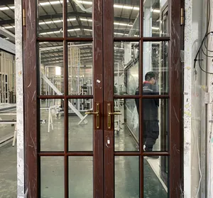 Clearance exterior double doors stacked in a building supply warehouse