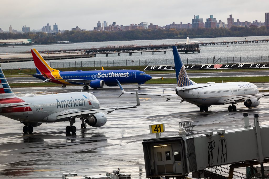Commercial airplanes from Southwest, Alaska, Delta, and American Airlines preparing for departure.