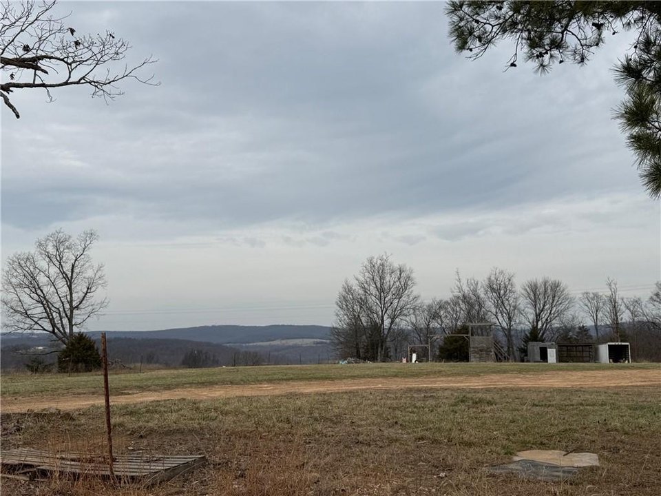 Different types of cheap land in Arkansas including residential, farmland, and wooded property