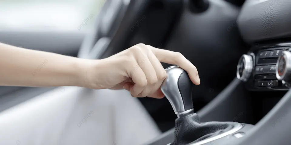 Driver shifting gears in a manual transmission car.