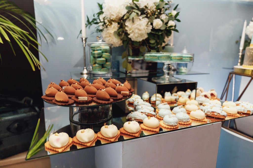 Expensive baby shower catering table vs DIY food setup. (Cheap Baby Shower Food Ideas)