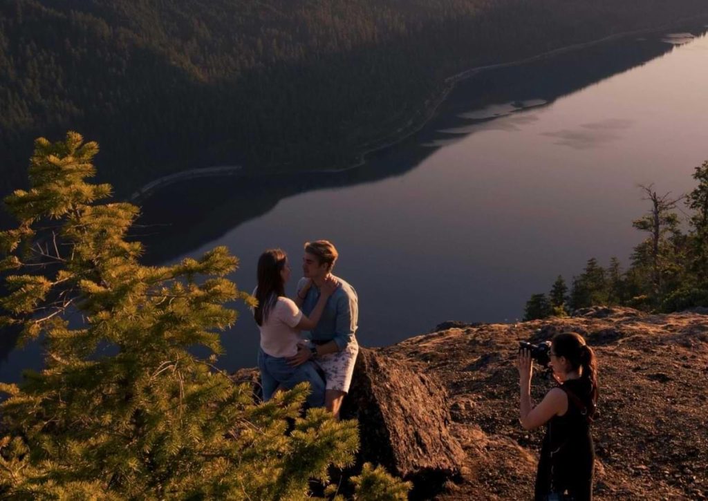 Family enjoying a picnic beside a peaceful river in the Smoky Mountains