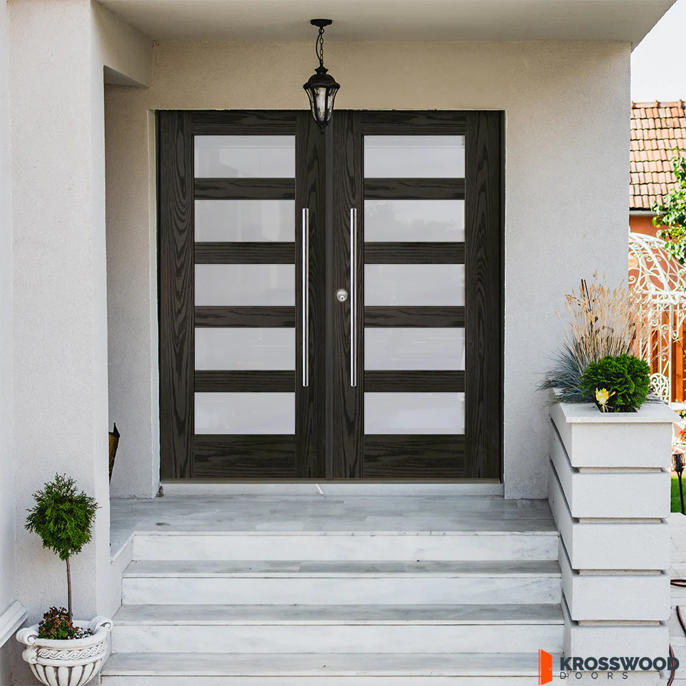 Fiberglass exterior double doors with wood grain finish installed on a residential home