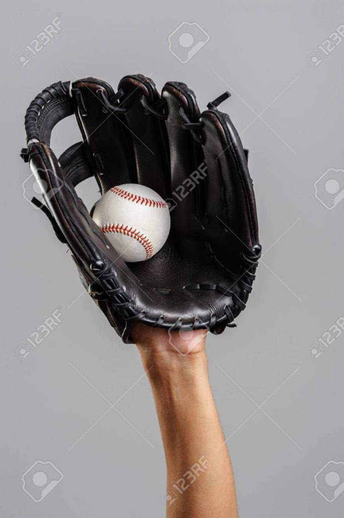 Glove forming shape around ball