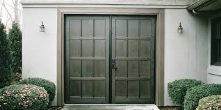 Homeowner comparing affordable exterior double doors in a home improvement showroom