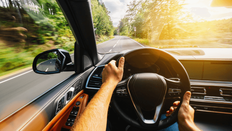 Buyer test driving used muscle car