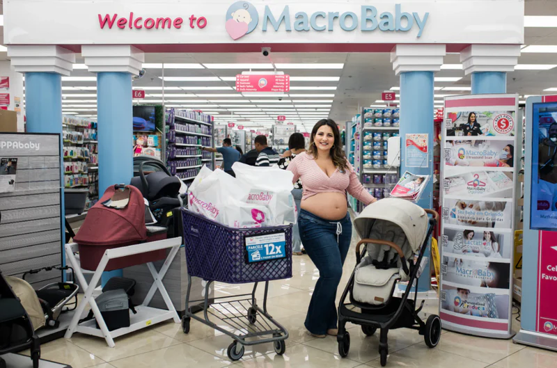 Parent browsing affordable strollers in a store aisle