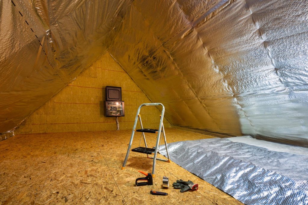 Radiant foil insulation installed in attic to reflect heat