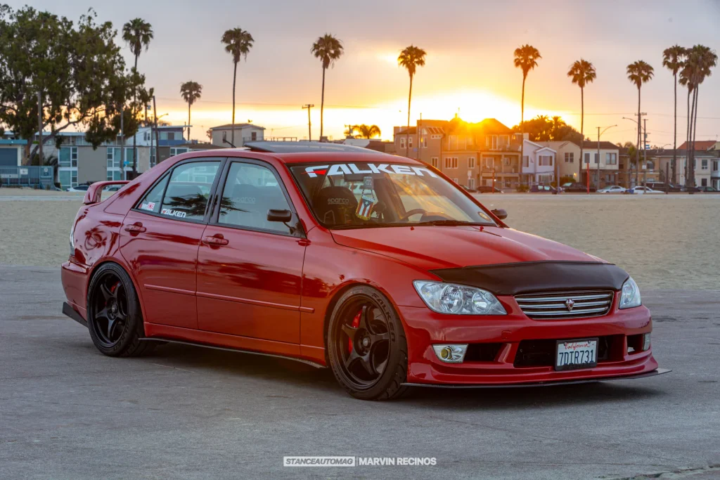 Red Lexus IS300 at sunset.