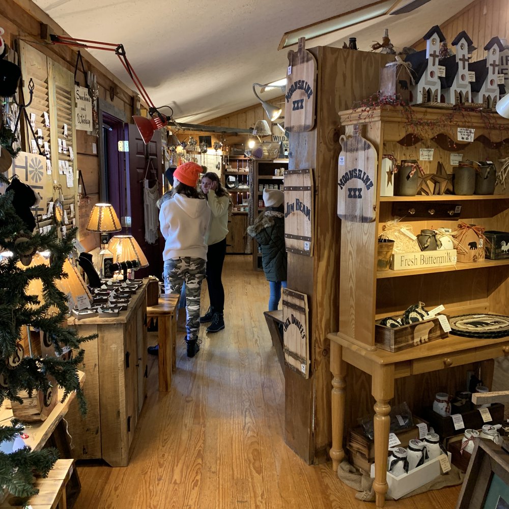 Shelves filled with Smoky Mountains themed souvenirs inside a Pigeon Forge gift shop