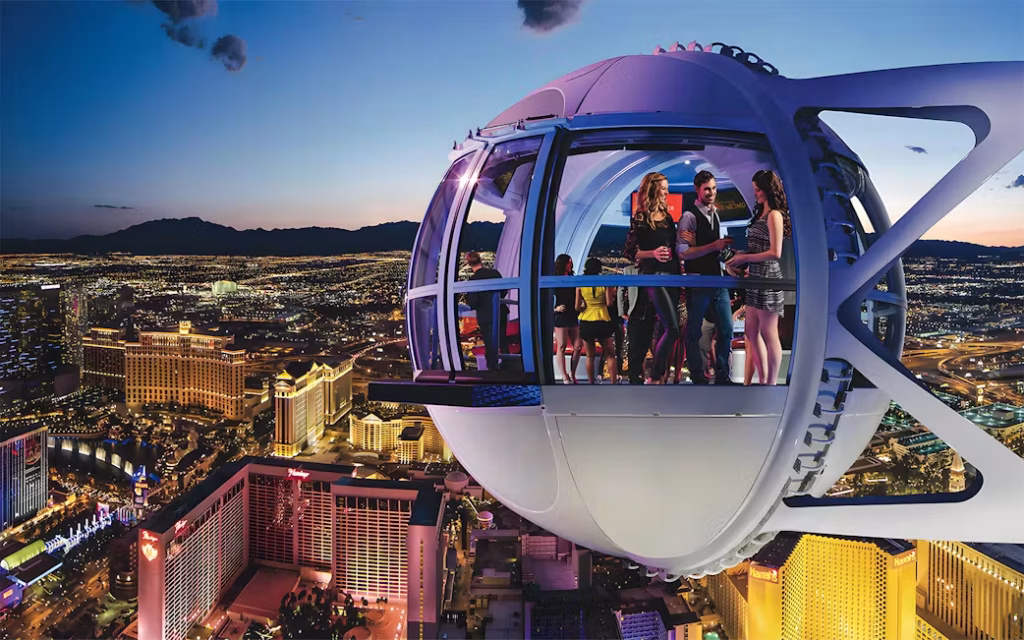 Tourists riding the High Roller observation wheel overlooking Las Vegas Strip