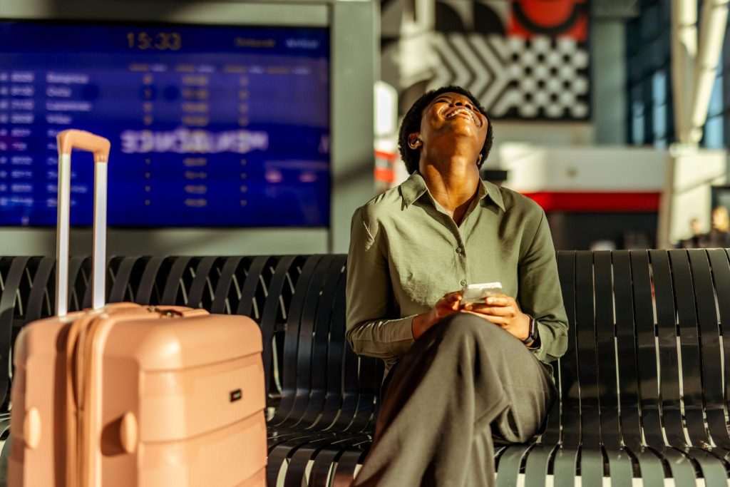 Traveler celebrating finding cheap flights from Sacramento at the airport