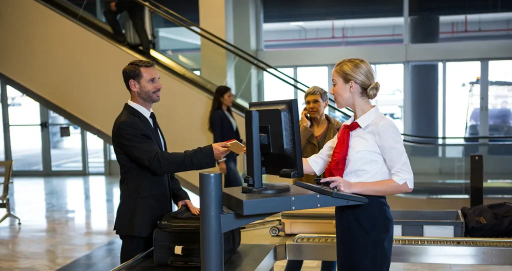 Traveler checking baggage weight at airport before boarding a cheap flight from Boise.