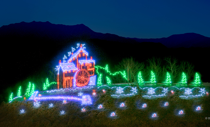 Visitors attending a seasonal festival with lights and decorations in Pigeon Forge