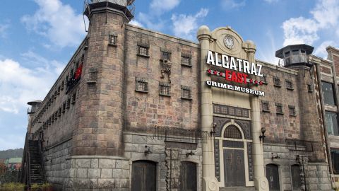 Visitors comparing attraction tickets and combo passes for savings