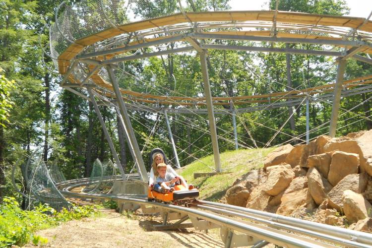 Visitors riding a mountain coaster attraction in Pigeon Forge Tennessee