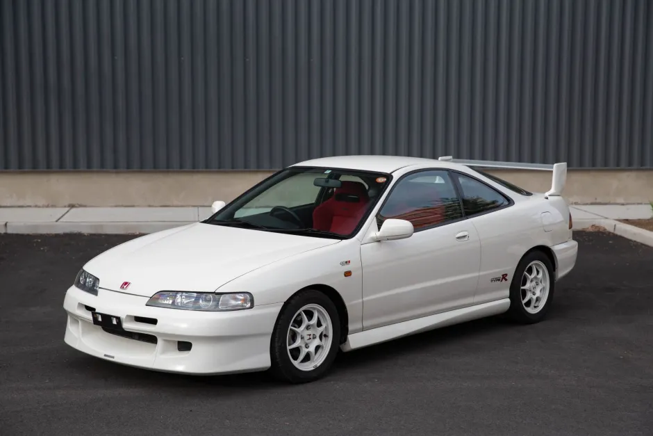White Acura Integra Type R parked outside.