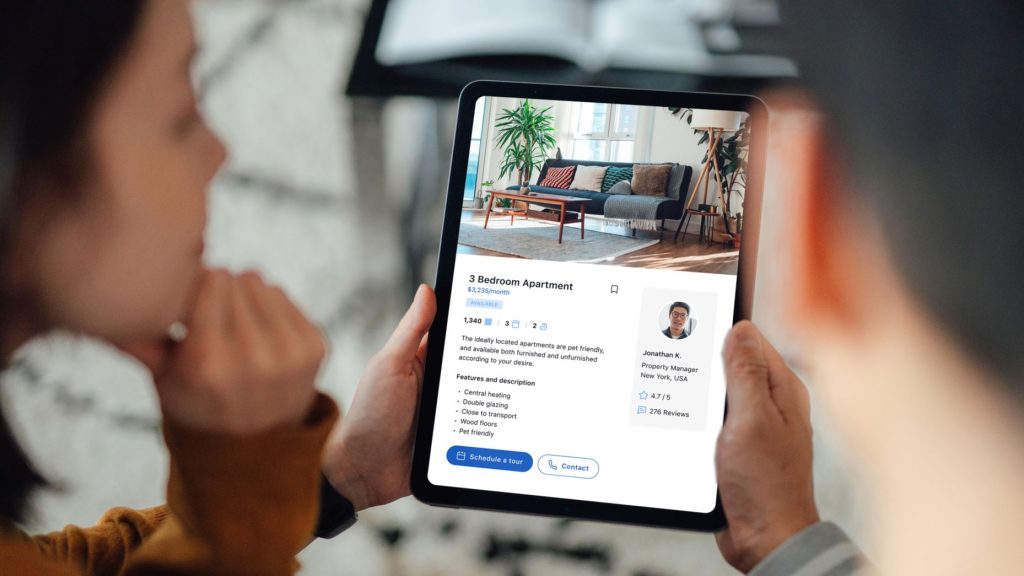 Person searching cheap apartments online using rental listing websites