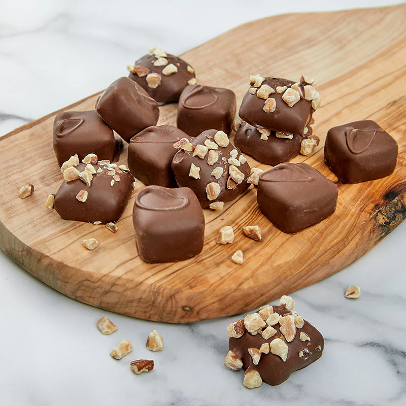 Variety of flavored Cheap Charlies snack packs and jars available in US stores