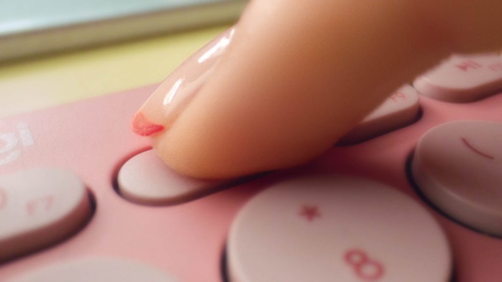 membrane keyboard typing close up